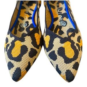 Rothy’s pointed toe flats in leopard print with electric blue detail!
